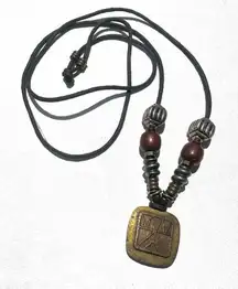 Baer SF sterling silver and brass pendant necklace on black cord