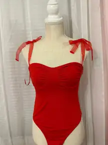 - Red corset bodysuit with ruched bust and bow ties, size 8 (large)