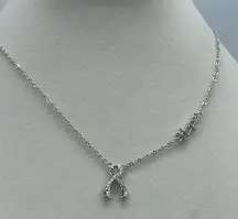 A.U. Ribbon and Hope Rhodium plated CZ necklace.