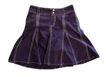 Athleta skort with 2 button front snaps and zipper with rear pockets.
