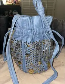 BLUE VEGAN LEATHER BUCKET BAG WITH SILVER AND GOLD STUDS AND DECOR