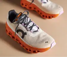 On Cloudmonster in Fawn/Tumeric