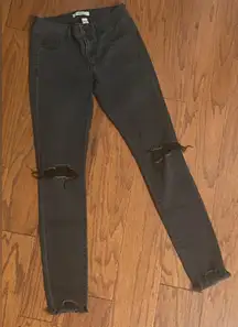 Refuge black rugged mid rise jeans - size 2. gently warn and excellent condition for rugged jeans. Holes in kneecap areas only & ankles. Measurements approximately 13” waste x 9” rise x 37” long. Non smoking home. priced to sell at as is condition. Don’t like my price, make reasonable offer! And thank you for checking my closet.