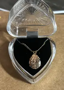 gold-tone chain necklace featuring a pear-shaped crystal pendant, Swarovski