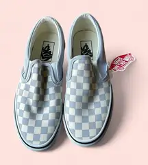 Blue and white checkered Vans slip ons