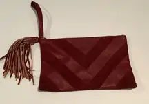 Carlos Santana burgundy clutch