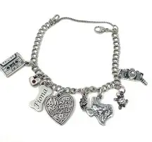 James Avery sterling silver charm bracelet, 8 charms