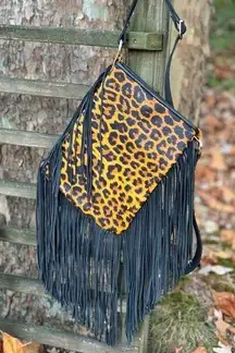 Leopard print with fringe crossbody purse with adj strap 10”x13” leather
