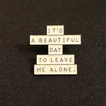 Enamel pin/magnet starts off nicely enough, but takes a sharp turn