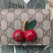 Gucci 🍒🍒🍒  sparkly cherry mini bifold wallet. OMG the cutest. 🍒🍒🍒