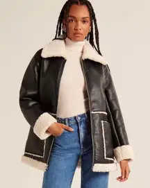 . Women's Vegan Leather Shearling Jacket. Size: XS but fits oversized. Only worn once! Great material, super thick for fall/winter! Originally bought for $180