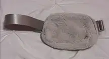 White fuzzy Lululemon belt bag