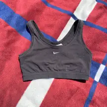 Vtg  crop top with the center  swoosh at the front. This is great to work out in or to wear as a cute statement piece. Tagged a women’s size large L Color: black