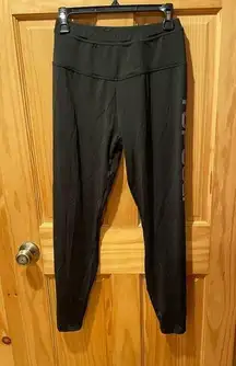 Top Golf black logo on leg women’s size M leggings used in good condition