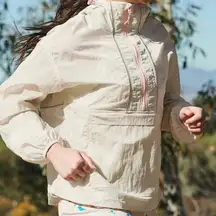 Fabletics Shimmer Hiking Jacket cream windbreaker with Pink Accents raincoat