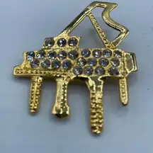 Vintage rhinestone baby grand piano brooch.