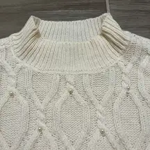 And now this cable knit mock neck long sleeve sweater size small pearl detail