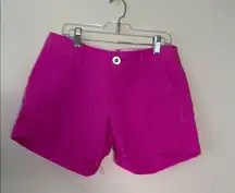 Lilly Pulitzer hot pink shorts with gold button and wavy texture