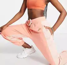 Nike X Serena DesignCrew cuffed fleece sweatpants in coral sherbert