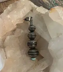 Navajo saucer sterling is Silver pendant