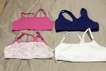 Set of 4 size medium sports bras NWOT