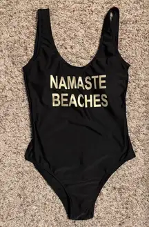 Namaste Beaches Black One Piece Swimsuit with Gold Text