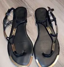 Women’s black and gold sandals size 8