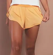 Free People Movement Game Time High Rise Shorts in Orange Size S