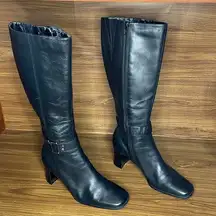 Tall black leather heeled boot
Women’s 7 M 

Bandolino