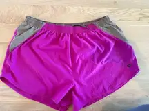 Pearl Izumi fuschia and tan running shorts size large