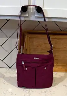 Baggalline magenta adjustable crossbody bag travel casual lots of pockets