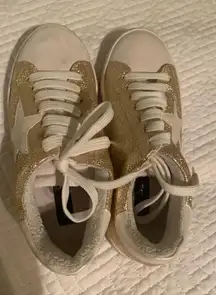 Gold sneakers with star