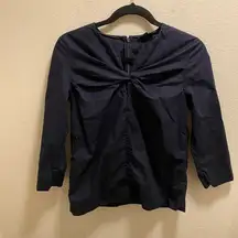 Cos Twist Front Navy Blouse with 3/4 Sleeves and zippered back.