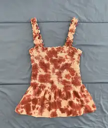 Soft pink tie dye ruffle strapless dress with straps.