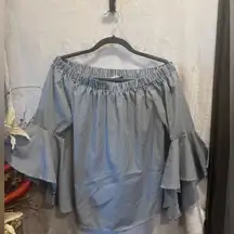 Modern off the shoulder bell sleeve blouse
Size L