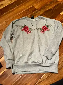 Women’s  rose distressed sweatshirt. Size large