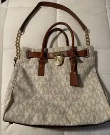 Michael Kors White MK Logo bag with gold hardware.