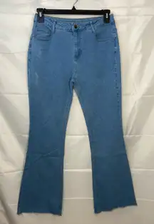 EUC Women’s medium/light wash blue stretch flare leg distressed‎ hem jeans XL