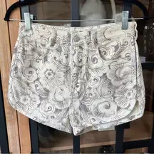 Pilcro denim shorts high rise floral curve tulip hem Anthropologie boho beige