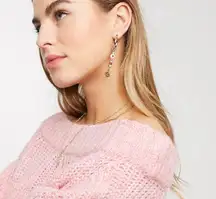 Earrings with playful bead drops and safety pin in gold tone