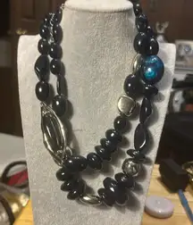 Beautiful Chicos necklace. One of the large beads has a swirl of beautiful blue.
