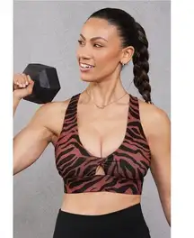 Fabletics Oasis Twist Medium Impact Sports Bra Sz XS in Mahogany Zebra Stroke