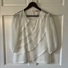White Blouse with Decorative Embellishments and Puffed Sleeves