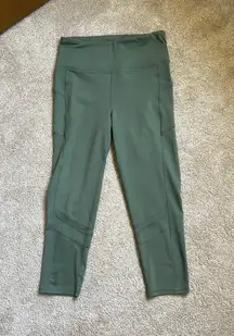 Olive Green Leggings With Dual Pockets and Mesh Detailing Around Calves