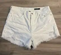 White ripped shorts