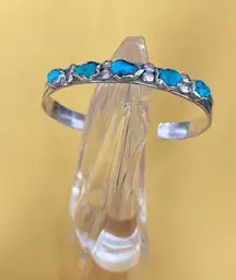 Vintage Navajo SC Nastacio sterling silver turquoise stone cuff bracelet.