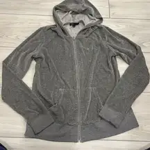 bcbg maxazria gray zip up size medium with a crown jewel detailing sewed on.. su