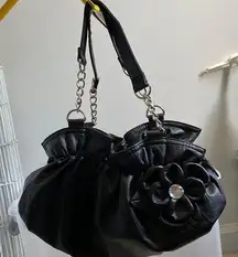 Black purse with flower detail