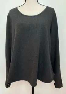 dark grey open back sweatshirt with multicolor pilling detail and thumb holes