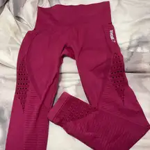 Gymshark woman’s raspberry Burgundy Leggings w cutout. Design Yoga